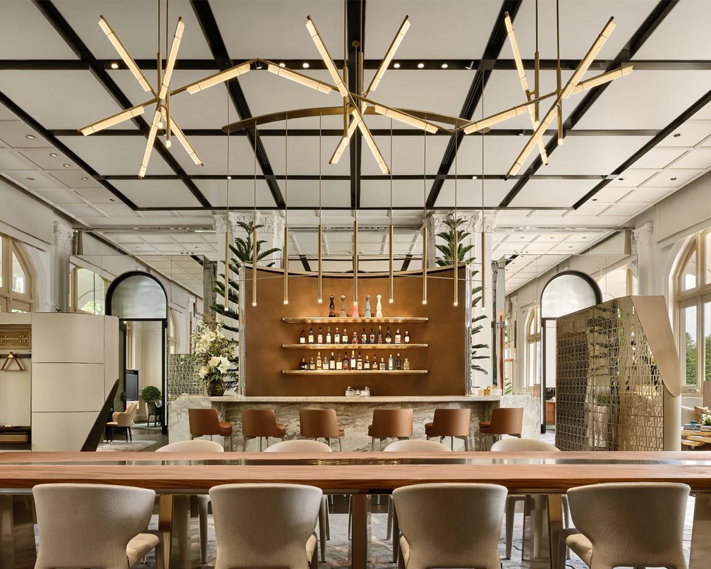Custom feature pendants in brass and glass over the bar, Audemars Piguet flagship, Raffles Hotel Singapore